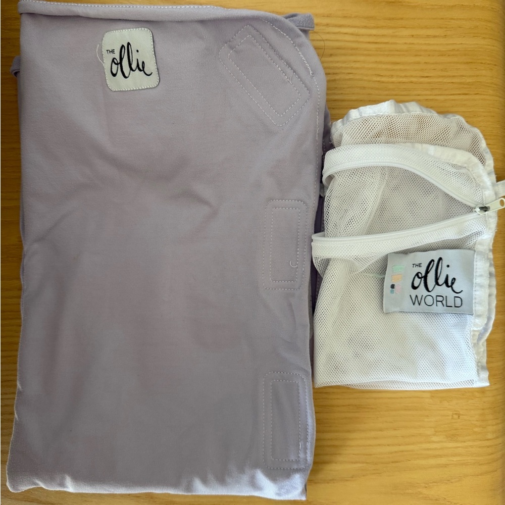 The Ollie sleep swaddle in lavender with mesh laundry bag